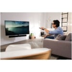 bartelstilburg-next-8375-ambiance-image-living-room-man-using-remote-control.png